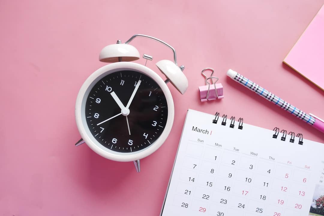 Alarm clock and calendar representing legal deadlines and statute of limitations