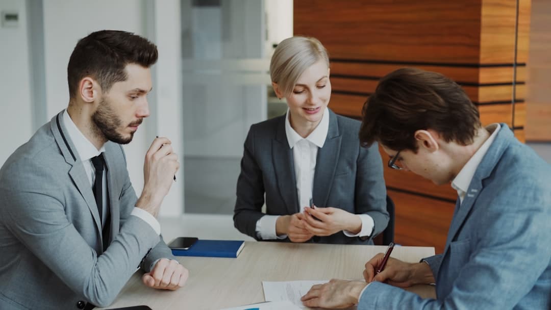 Attorney meeting with clients to review estate planning documents