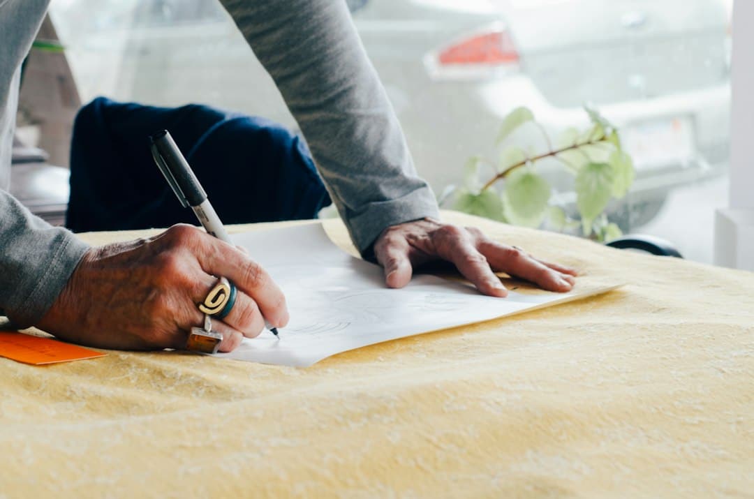 A person signing a legal document with a pen
