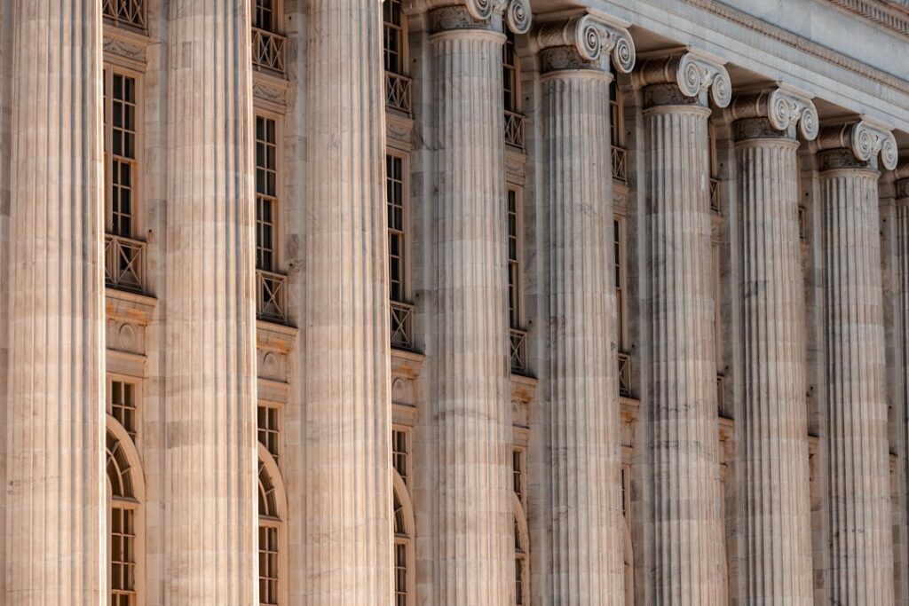 Courthouse building with columns and a clock on the front