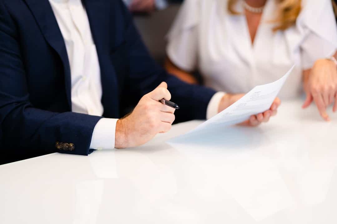A couple meeting with an advisor about estate planning at a table