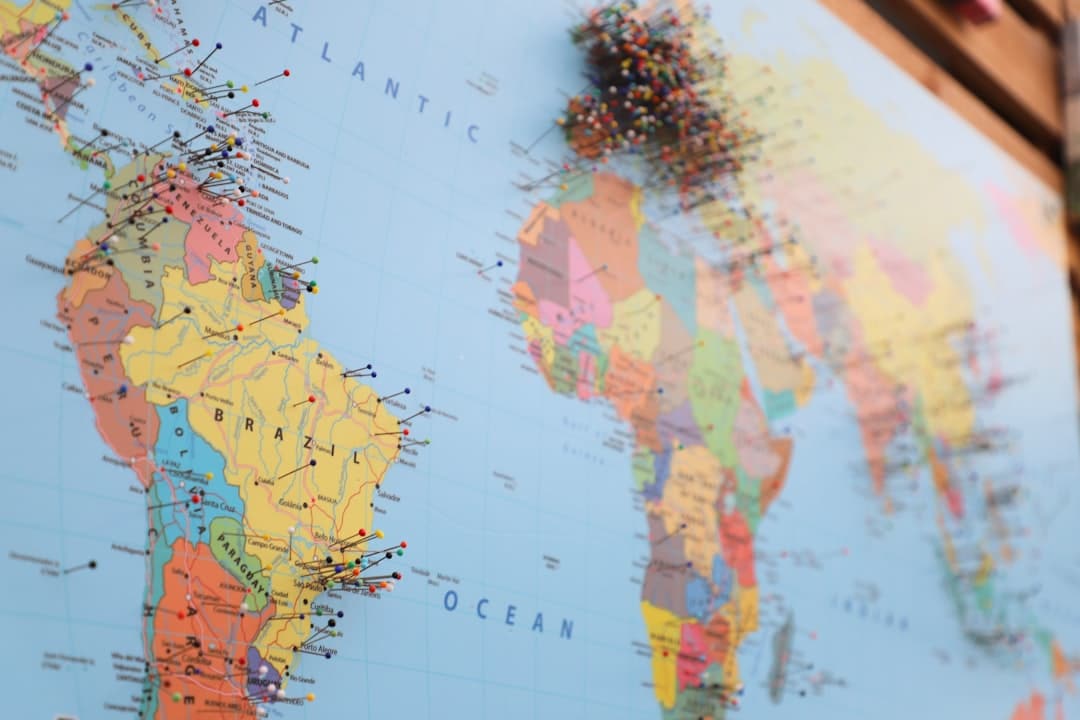 A world map with pins marking locations in multiple countries