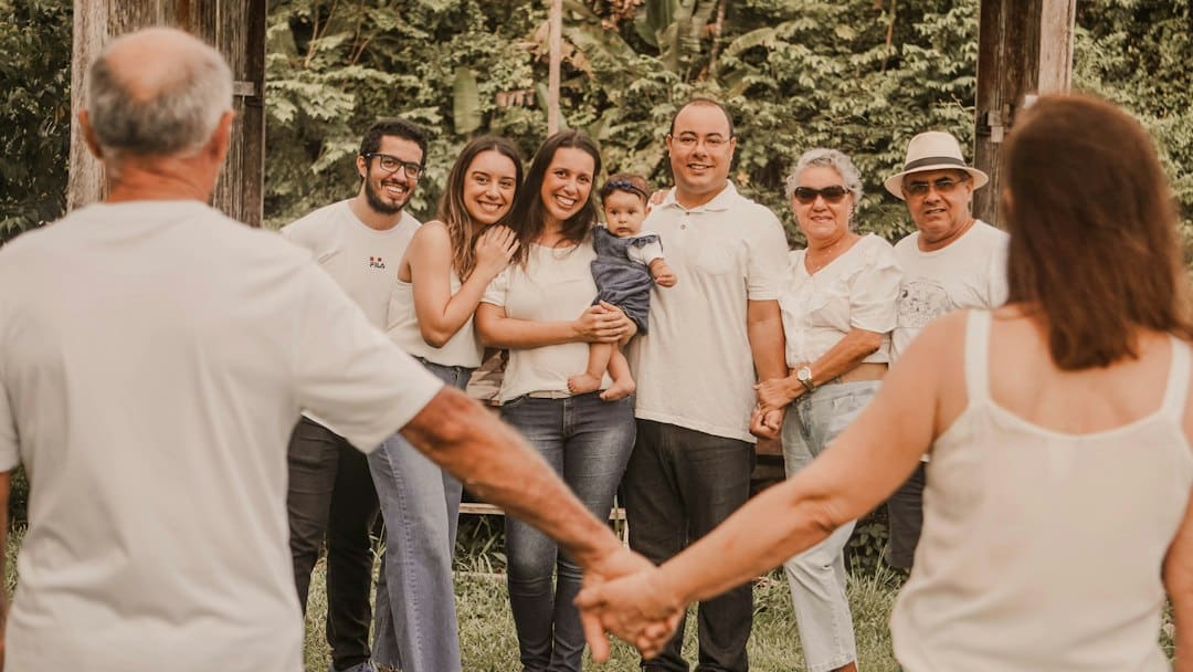 A family holding hands together outdoors